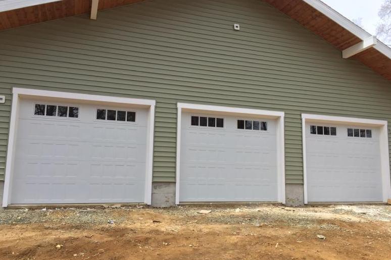 Three white shaker style doors with Madison Glass.